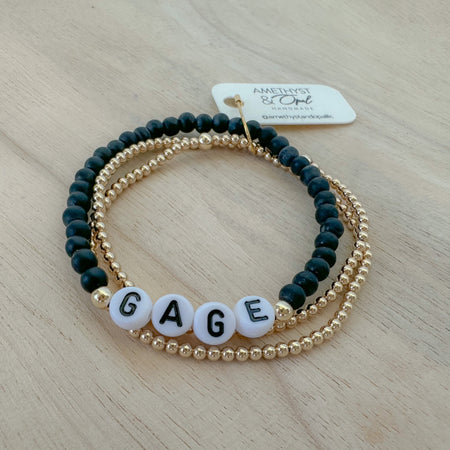 Personalized onyx beaded bracelet with custom name or word. Bold, meaningful, and perfect for stacking bracelets or gifting.