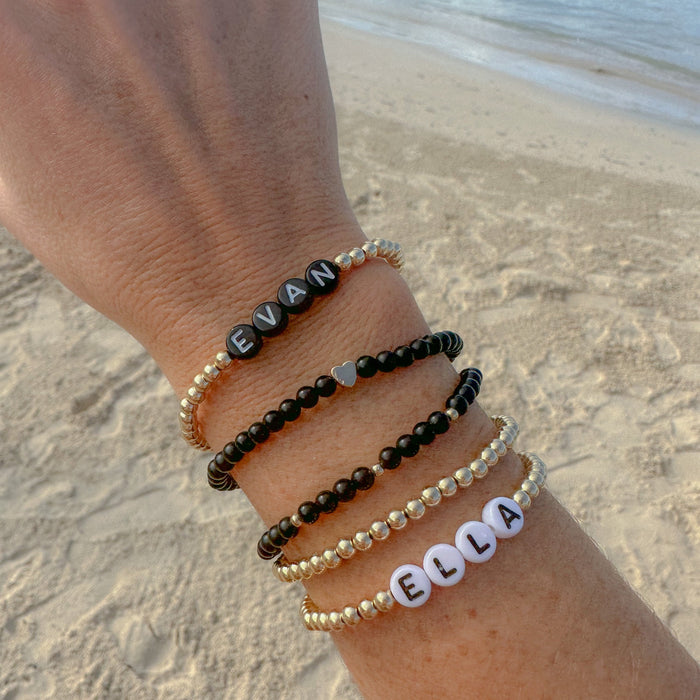Custom personalized name bracelet with initials, names, or meaningful words. Perfect for stacking bracelets, layering, and gifting.