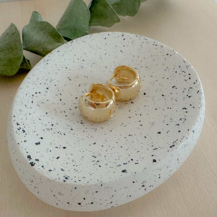 Chunky Gold Huggies – tiny, lightweight gold-filled hoops with understated shine. Staff favorite statement earrings perfect for day-to-night wear and stacking.