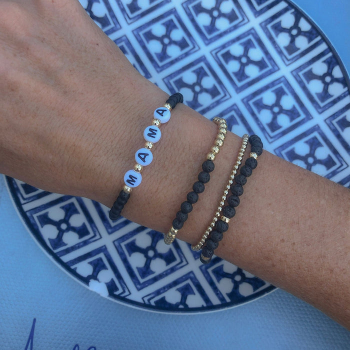 Personalized onyx beaded bracelet with custom name or word. Bold, meaningful, and perfect for stacking bracelets or gifting.
