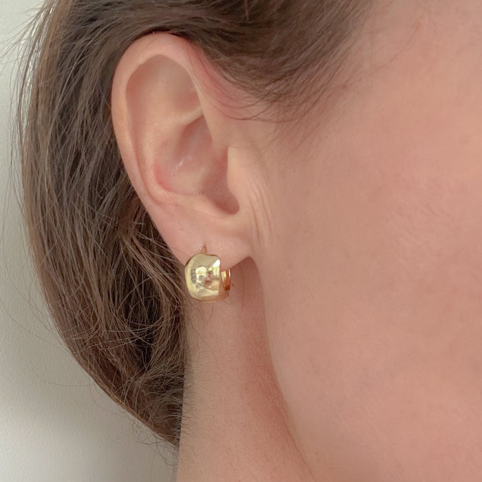 Chunky Gold Huggies – tiny, lightweight gold-filled hoops with understated shine. Staff favorite statement earrings perfect for day-to-night wear and stacking.