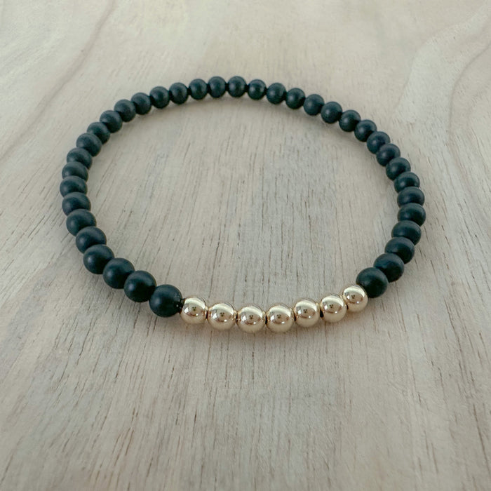 Discover the Onyx Bracelet Stack—genuine onyx gemstone and gold beaded bracelet set. A meaningful, stylish jewelry gift for everyday wear.