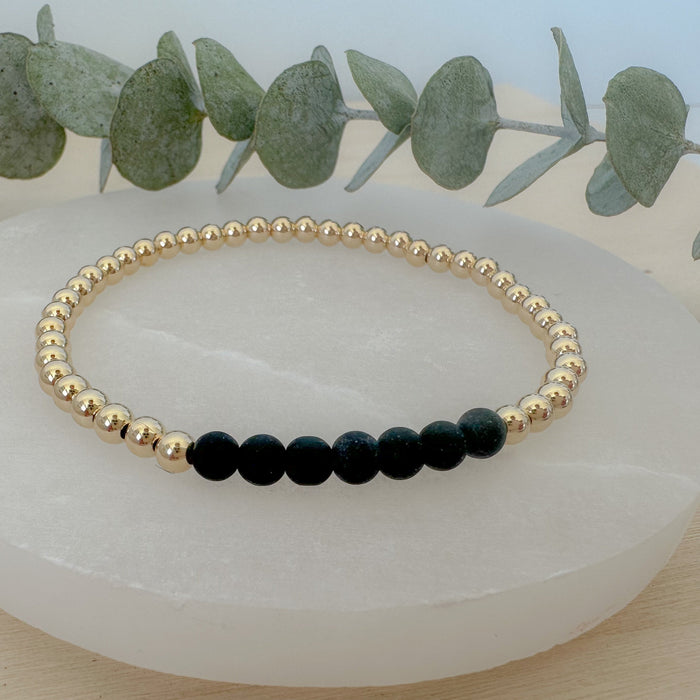 Discover the Onyx Bracelet Stack—genuine onyx gemstone and gold beaded bracelet set. A meaningful, stylish jewelry gift for everyday wear.