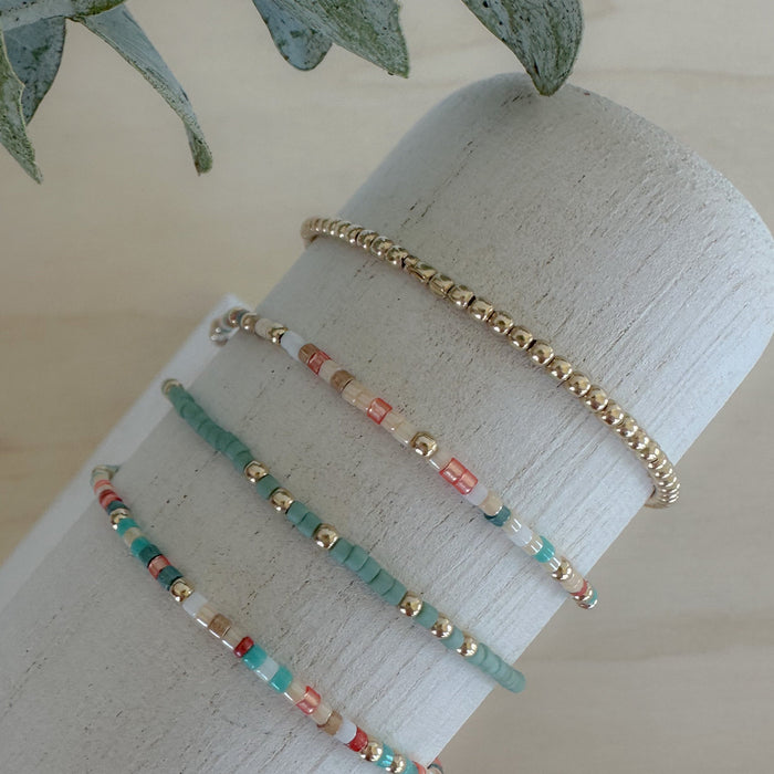 Sedona Stack: earthy, dainty bracelet set in beige, sand, sage, and terracotta—perfect for spring layering and everyday style.
