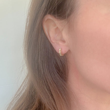 Hex Huggies – trendy geometric gold-filled huggie earrings. Lightweight, tarnish-resistant, perfect for stacking or solo wear. Modern, everyday gold hoops.
