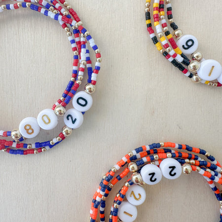 Celebrate every goal with our Colorful Team Stack Bracelet—personalized number charm, bright beads, and the perfect way to show you’re their biggest fan.