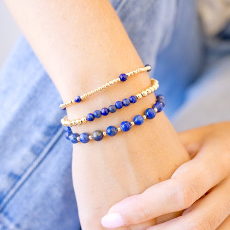 lapis beaded bracelet close up with gold beads stack of all three closer up showing detail 
