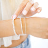 set of three sterling silver bracelets three different bead sizes  on wrist 