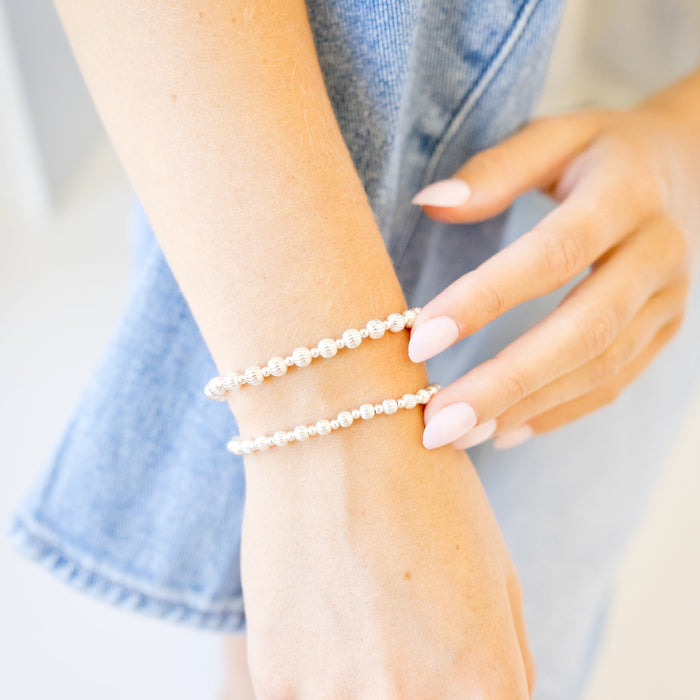 textured beaded bracelets on wrist - sterling silver 