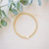 Gold beaded bracelet with single freshwater pearl 