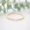 Gold beaded bracelet with single freshwater pearl 