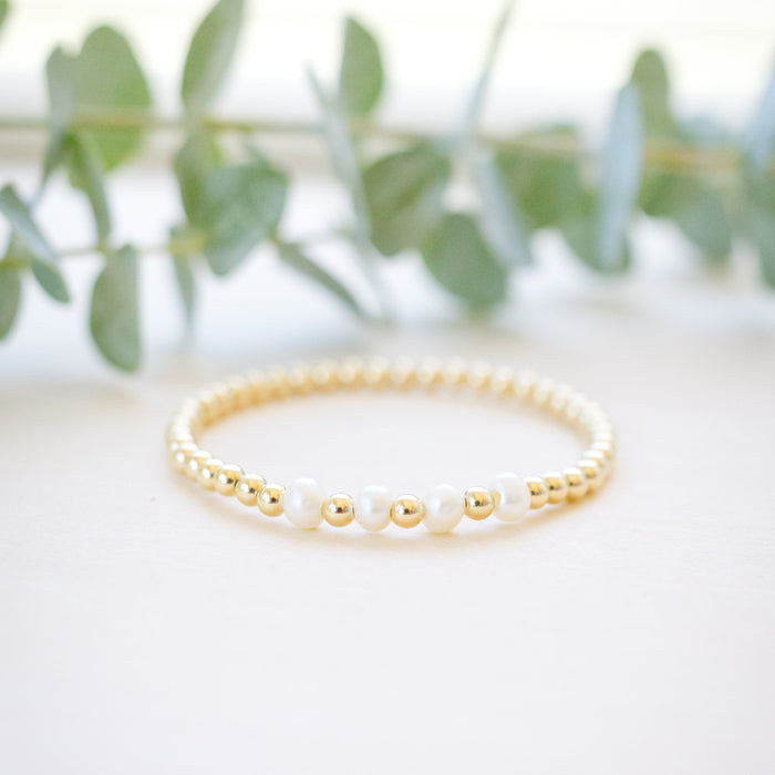Gold beaded bracelet with four freshwater pearl 