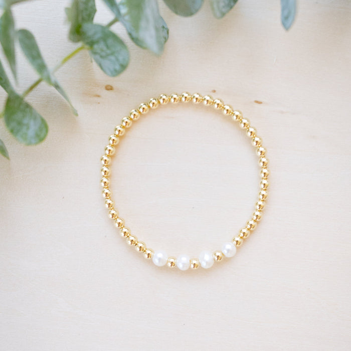 Gold beaded bracelet with single freshwater pearl four freshwater pearl 