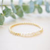 Gold beaded bracelet with freshwater pearl seven pearl across 