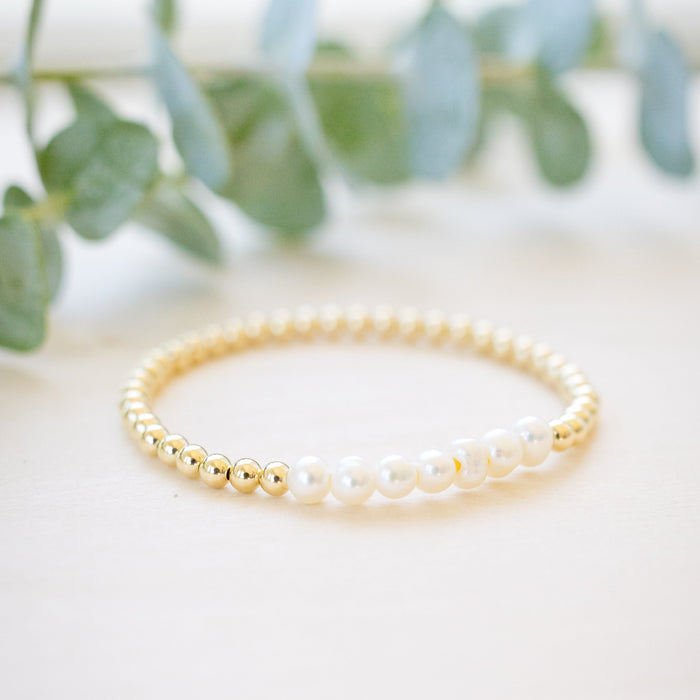 Gold beaded bracelet with freshwater pearl seven pearl across 