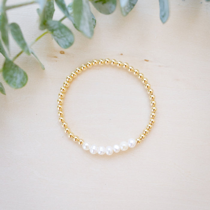 Gold beaded bracelet with freshwater pearl flatay seven pearls in a row