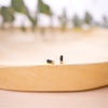 onyx baguette stud on wood bowl