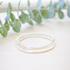 silver beaded bar bracelet on neutral background 