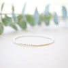 silver beaded bar bracelet on neutral background 