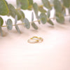 tiny pave huggies 15mm on wood with greenery