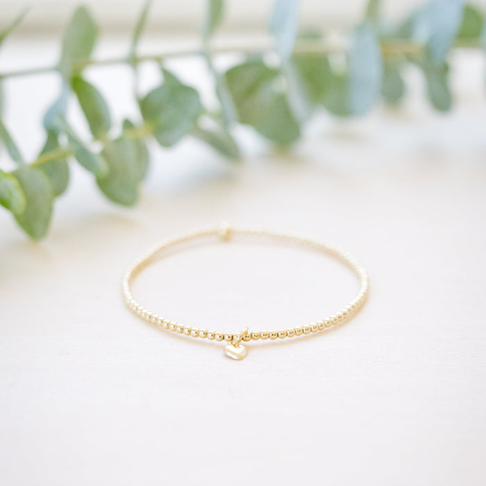 tiny beaded bracelet with tiny heart charm 