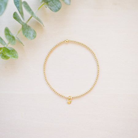 tiny beaded bracelet with tiny heart charm 