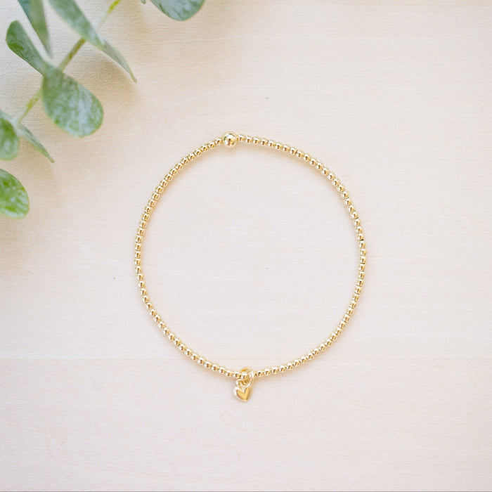 tiny beaded bracelet with tiny heart charm 