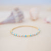 Beaded bracelet on a soft surface with a blurred background