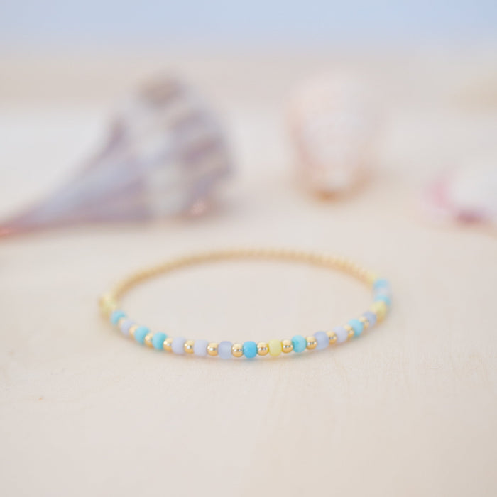 Beaded bracelet on a soft surface with a blurred background
