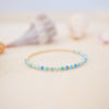 Beaded bracelet on a soft surface with a blurred background