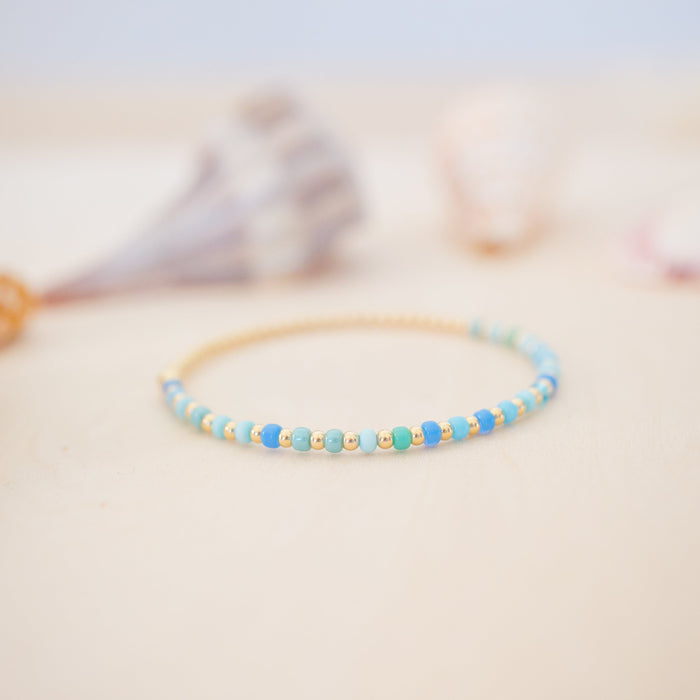 Beaded bracelet on a soft surface with a blurred background