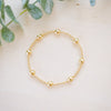 gold beaded bracelet with two size gold beads 