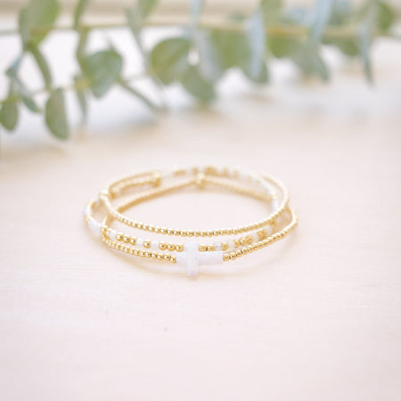 opal white cross on gold beaded bracelet 