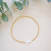 opal white cross on gold beaded bracelet 