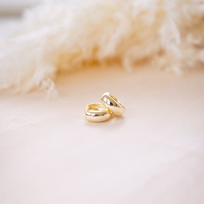 og classic timeless 13mm huggies on wood background