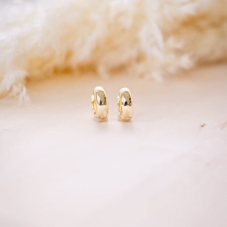 og classic timeless 13mm huggies on wood background