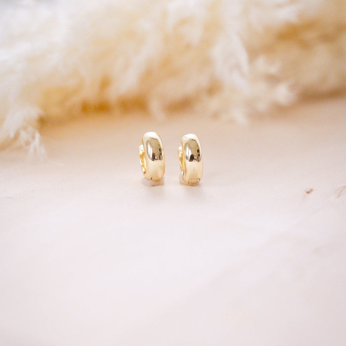 og classic timeless 13mm huggies on wood background