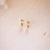 og classic timeless 13mm huggies on wood background
