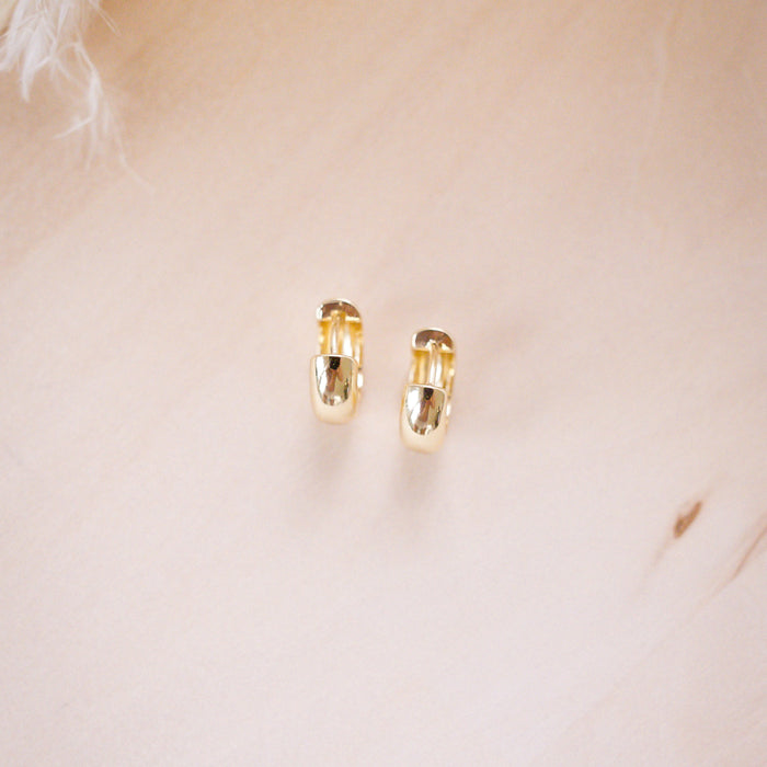og classic timeless 13mm huggies on wood background