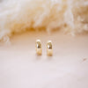 og classic timeless 13mm huggies on wood background