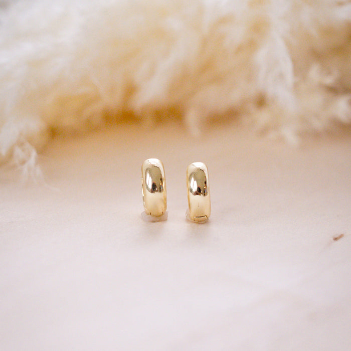 og classic timeless 13mm huggies on wood background