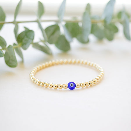 gold beaded blue and white glass evil eye bracelet - gold beaded 