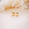 shiny gold fat huggies on wood background