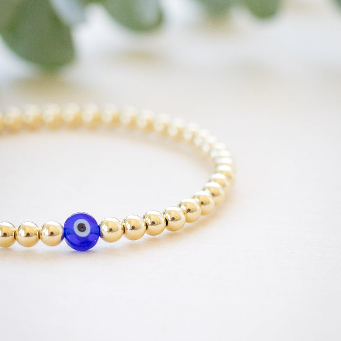 gold beaded blue and white glass evil eye bracelet - gold beaded 