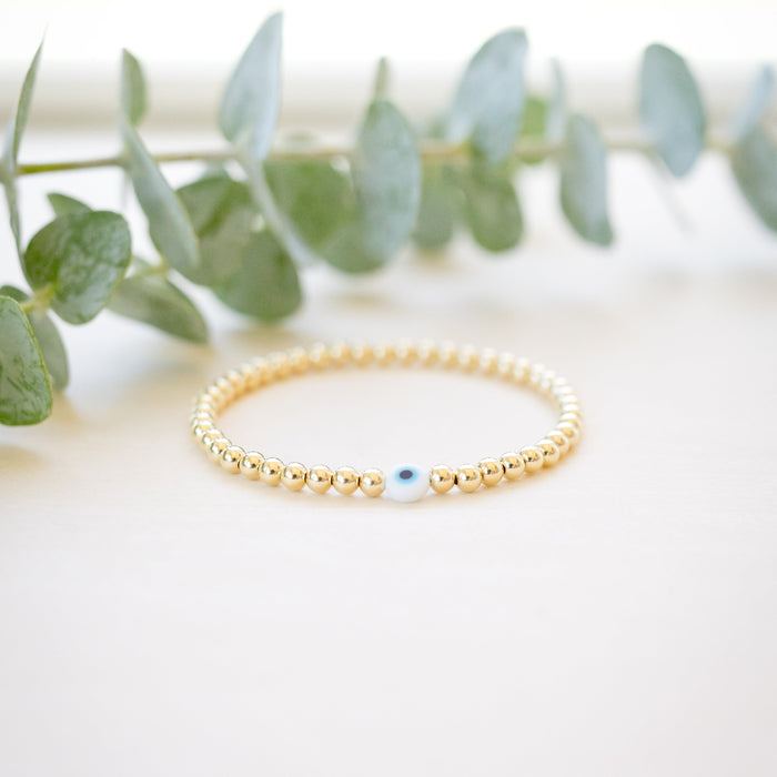 gold beaded blue and white glass evil eye bracelet - gold beaded 