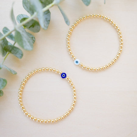 gold beaded blue and white glass evil eye bracelet - gold beaded 