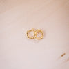 teeny twist hoops on wood background