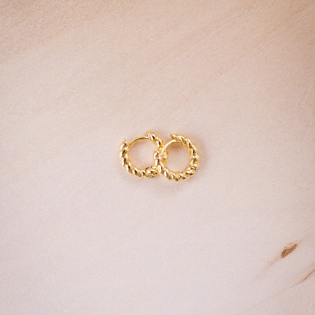 teeny twist hoops on wood background