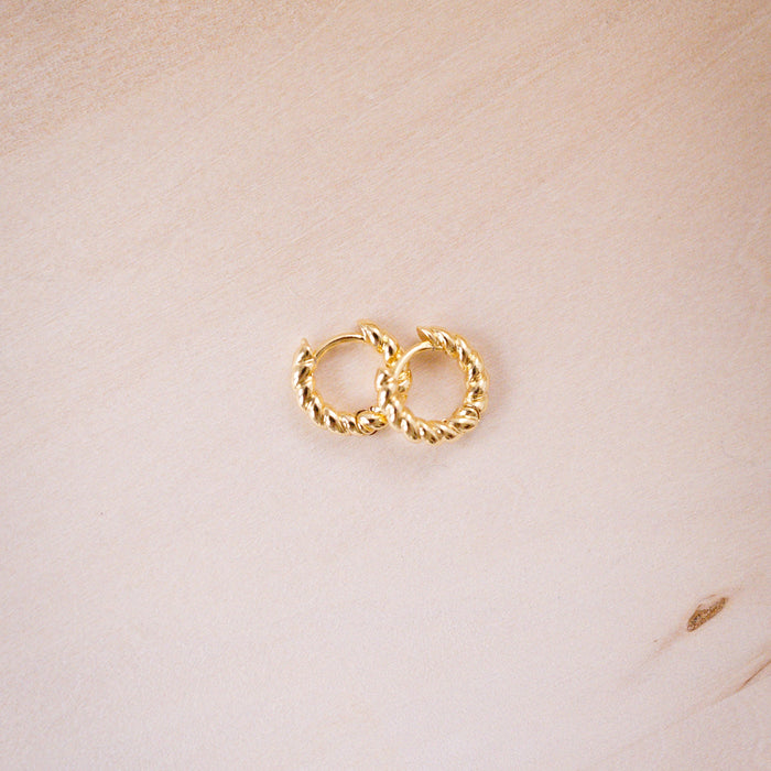 teeny twist hoops on wood background