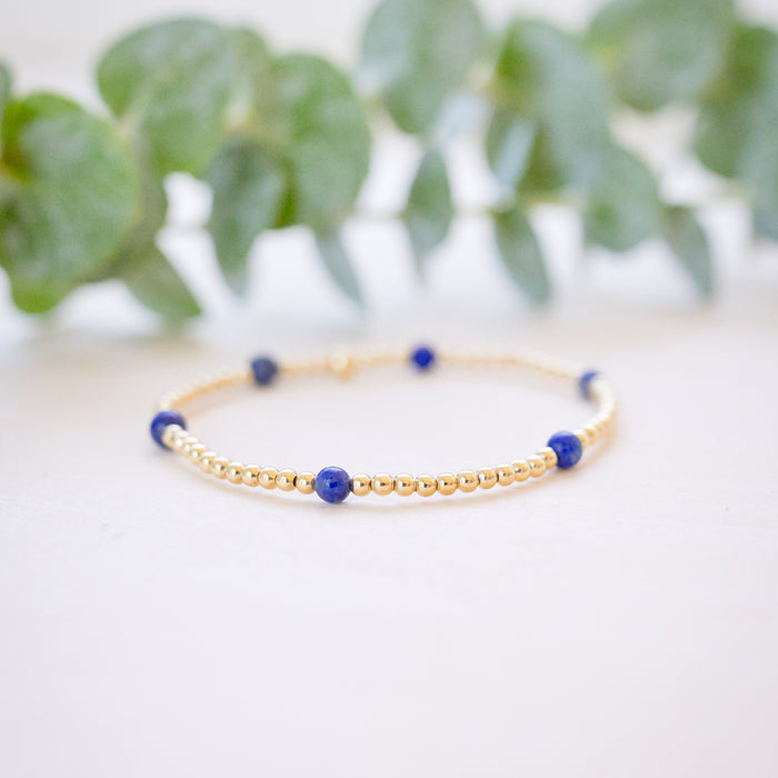 lapis beaded bracelet close up with gold beads 
